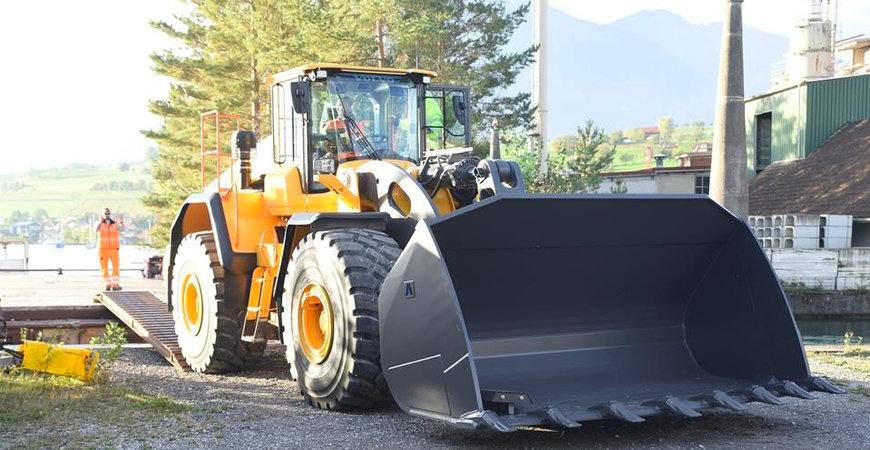 VOLVO CE FLOATS L260H ACROSS SWISS LAKE TO CUSTOMER QUARRY